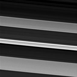In this image from NASA's Cassini spacecraft, a bright and narrow ringlet located toward the outer edge of the C ring is flanked by two broader features called plateaus.