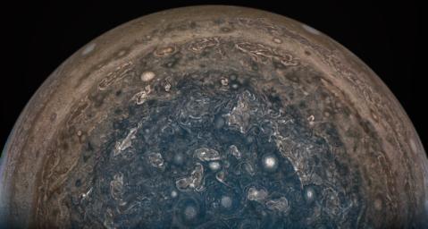 NASA's Juno spacecraft soared directly over Jupiter's south pole when JunoCam acquired this image on February 2, 2017. This enhanced color version highlights the bright high clouds and numerous meandering oval storms.