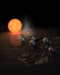 The TRAPPIST-1 star, an ultra-cool dwarf, has seven Earth-size planets orbiting it. This artist's concept appeared on the cover of the journal Nature in Feb. 23, 2017 announcing new results about the system.