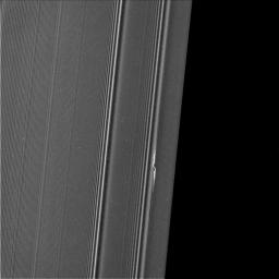 The propeller informally named 'Earhart' is seen in this view from NASA's Cassini spacecraft at much higher resolution than ever before. In this view, half of the Encke Gap is visible as the dark region at right.