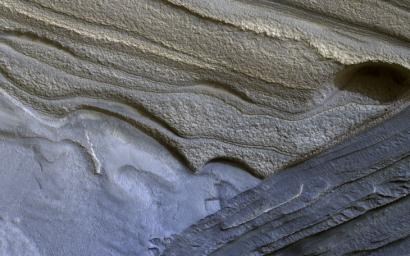 This image from NASA's Mars Reconnaissance Orbiter shows Mars' north polar layered deposits are a thick stack of dusty water ice layers.