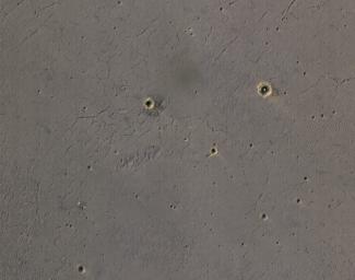 The bright landing platform left behind by NASA's Mars Exploration Rover Opportunity in 2004 is visible inside Eagle Crater, at upper right in this April 8, 2015, observation by NASA's Mars Reconnaissance Orbiter.