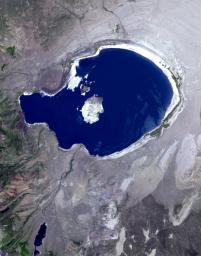 In eastern California, along the western edge of the Great Basin, sits Mono Lake, as shown in this image from NASA's Terra spacecraft. This is a salty remnant of a wetter era. Estimates are that the lake existed for at least 760,000 years.