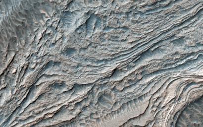 This image from NASA's Mars Reconnaissance Orbiter shows that layered deposits in Melas Basin may have been deposited during the growth of a delta complex.