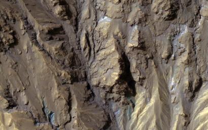 The sources of channels on the north rim of Hale Crater show fresh blue, green, purple and light toned exposures under the overlying reddish dust, captured by NASA's Mars Reconnaissance Orbiter.