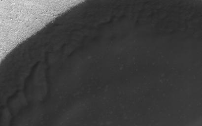 This image captured by NASA's Mars Reconnaissance Orbiter (MRO) shows a moderate sized dune field that displays most of these morphologic features and a noticeable absence of dune crests.