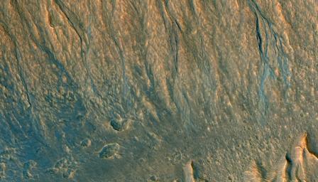 This observation from NASA's Mars Reconnaissance Orbiter (MRO) is an oblique view of gully deposits from the steep slope of an impact crater.