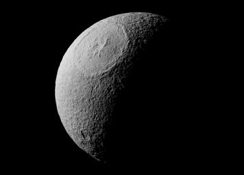 On Aug. 17, 2015, NASA's Cassini spacecraft captured this image of Odysseus crater with its ring of steep cliffs and the mountains that rise at its center, the most visually striking feature on Saturn's icy moon, Tethys.