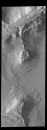 This image from NASA's 2001 Mars Odyssey spacecraft shows late afternoon shadows. This image is located in Cavi Angusti.