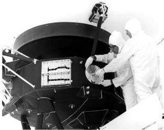 Engineers secure the cover over NASA's Voyager 1 Golden Record in 1977.