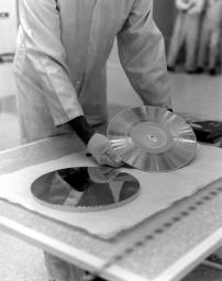 NASA's Voyager 1 Golden Record is prepared for installation on the spacecraft in this archival image from 1977.