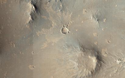 This image from NASA's Mars Reconnaissance Orbiter shows one of millions of small craters and their ejecta material that dot the Elysium Planitia region of Mars.