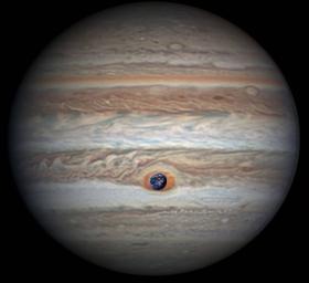 This composite image was generated by combining NASA imagery of Earth with an image of Jupiter taken by astronomer Christopher Go. Jupiter's Great Red Spot is 1.3 times as wide as Earth.