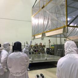 Members of the InSight mission's assembly, test and launch operations (ATLO) team remove the 'birdcage' from NASA's InSight spacecraft.
