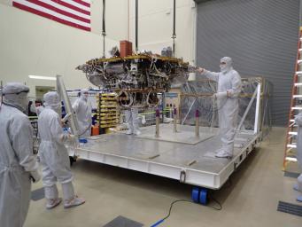 The Mars lander portion of NASA's InSight spacecraft is lifted from the base of a storage container in preparation for testing, in this photo taken June 20, 2017, in a Lockheed Martin clean room facility in Littleton, Colorado.