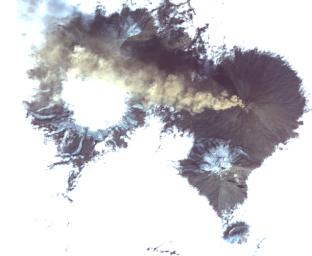 This image from NASA's Terra satellite, acquired on Aug. 20, 2017, shows Shiveluch, one of the world's most active volcanoes, poking through above a solid cloud deck, with an ash plume streaming to the west.
