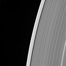 This image of Saturn's outer A ring features the small moon Daphnis and the waves it raises in the edges of the Keeler Gap. The image was taken by NASA's Cassini spacecraft on Sept. 13, 2017. It is among the last images Cassini sent back to Earth.