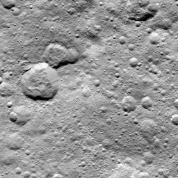 This image from NASA's Dawn spacecraft shows a group of craters, left of center, that resembles a rubber duck. The 'head' is dubbed Halki Crater, the 'Body' Telepinu Crater, the 'beak' crater is unnamed.