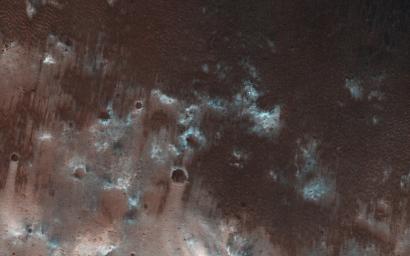 This view from NASA's Mars Reconnaissance Orbiter shows the downwind stretches of a sand sheet in central part of the much larger Herschel Crater.