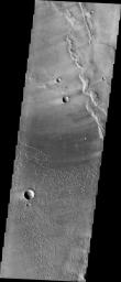 This image captured by NASA's 2001 Mars Odyssey spacecraft shows part of the dune field near Meroe Patera. Winds are blowing the dunes across a rough surface of regional volcanic lava flows.