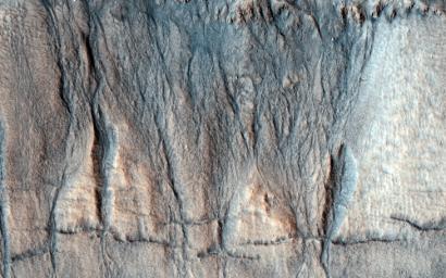 This observation from NASA's Mars Reconnaisance Orbiter captures details regarding the evolution of gully features observed in a crater in Acidalia Planitia.