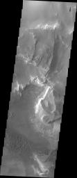 Melas Chasma is part of the largest canyon system on Mars, Valles Marineris. This image from NASA's 2001 Mars Odyssey spacecraft shows layered materials and sand dunes.