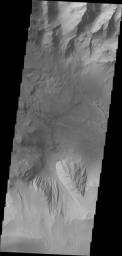 This image from NASA's 2001 Mars Odyssey spacecraft shows part of eastern Candor Chasma. At the top of the image is the steep cliff between the upper surface elevation and the depths of Candor Chasma.