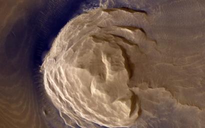 This image from NASA's Mars Reconnaissance Orbiter shows blocks of layered terrain within the Olympus Mons aureole. The aureole is a giant apron of chaotic material around the volcano.