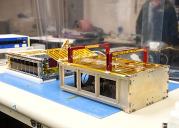 One of NASAs MarCO CubeSats inside a cleanroom at Cal Poly San Luis Obispo, before being placed into its deployment box.