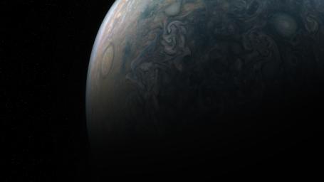 Tumultuous tempests in Jupiter's northern hemisphere are seen in this portrait taken by NASA's Juno spacecraft. Jupiter has cyclones and anticyclones, along with fast-moving jet streams that circle its globe.
