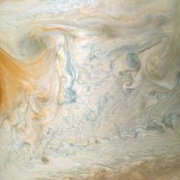 The easternmost edge of Jupiter's Great Red Spot and surrounding south tropical disturbance are captured in this image from NASA's Juno spacecraft.