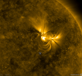 This close-up from a video clip taken May 30-June 1, 2018 by NASA's Solar Dynamics Observatory shows a large active region in extreme ultraviolet light as the bright magnetic field lines above it shift and twist.