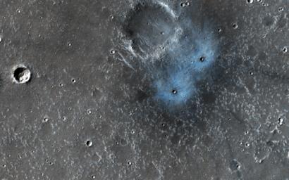 NASA's Mars Reconnaissance Orbiter observed this image of an impact crater. The blue appearance is due to the intense blast of the impact moving around dust on the surface. That dust is usually light-toned and reddish in color compared to what is beneath.