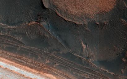 This image from NASA's Mars Reconnaissance Orbiter shows many new ice blocks compared to earlier images in 2006. One of the most actively changing areas on Mars are the steep edges of the North Polar layered deposits.