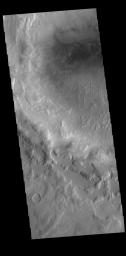 This image from NASA's Mars Odyssey shows an unnamed crater containing a small dune field located in the region between northern Terra Sabaea and Utopia Planitia.