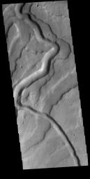 This image from NASA's Mars Odyssey shows Tyrrhenus Mons, one of the oldest Martian volcanoes. Tyrrhena Fossae is the largest of the channels dissecting the volcano.