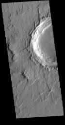 This image from NASA's Mars Odyssey shows an unnamed crater located northeast of Ascraeus Mons, on the volcanic plains of the Tharsis region. The rim has several concentric ridges.