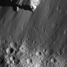 This image from NASA's Dawn spacecraft of boulders along Urvara Crater's wall was obtained from an altitude of about 28 miles (45 kilometers) above Ceres' surface.