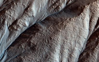 This image acquired on April 8, 2018 by NASA's Mars Reconnaissance Orbiter, shows the gullied western slopes of an unnamed crater (about 10 kilometers wide) in Acidalia Planitia.