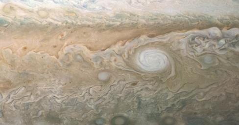 A swirling, oval white cloud in Jupiter's South South Temperate Belt is captured in this image from NASA's Juno spacecraft.