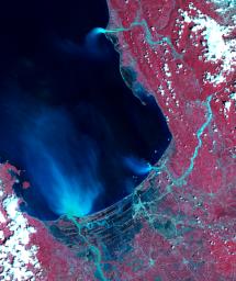 NASA's Terra spacecraft obtained this ASTER image of Dagupan and the Lingayen Gulf, showing flooded and water-saturated areas on September 22, 2018. Sediment-laden waters from swollen rivers enter the ocean and appear as blue-green plumes.