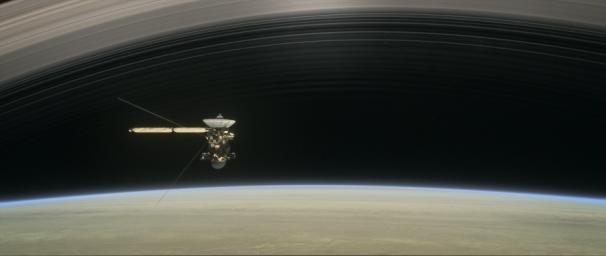 This illustration shows NASA's Cassini spacecraft about to make one of its dives between Saturn and its innermost rings as part of the mission's Grand Finale.
