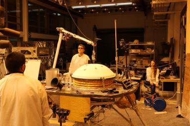 NASA's InSight mission tests an engineering version of the spacecraft's robotic arm in a Mars-like environment at NASA's Jet Propulsion Laboratory.