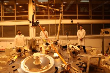An engineering version of the robotic arm on NASA's InSight mission lifts the engineering version of the Heat Flow and Physical Properties Probe (HP3) at NASA's Jet Propulsion Laboratory.