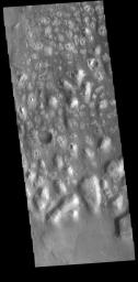 This image from NASA's Mars Odyssey shows Terra Cimmeria. The bright, irregular features are hills.