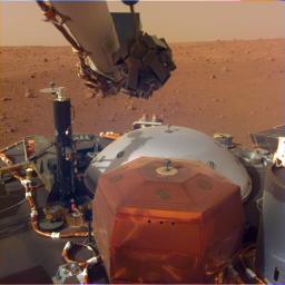 This image from InSight's robotic-arm mounted Instrument Deployment Camera shows the instruments on the spacecraft's deck, with the Martian surface of Elysium Planitia in the background.