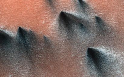 This image acquired on July 14, 2018 by NASA's Mars Reconnaissance Orbiter, shows Springtime in the South Polar region of Mars.