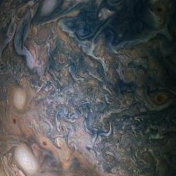 A multitude of bright white 'pop-up' storms in this Jupiter cloudscape appear in this image from NASA's Juno spacecraft.