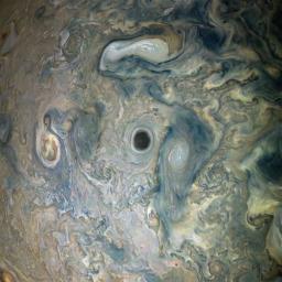 NASA's Juno spacecraft captured this view of an area within a Jovian jet stream showing a vortex that has an intensely dark center.