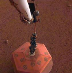 This set of images from the Instrument Deployment Camera shows NASA's InSight lander placing its first instrument onto the surface of Mars, completing a major mission milestone.